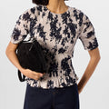 Top met bloemenprint en plooien